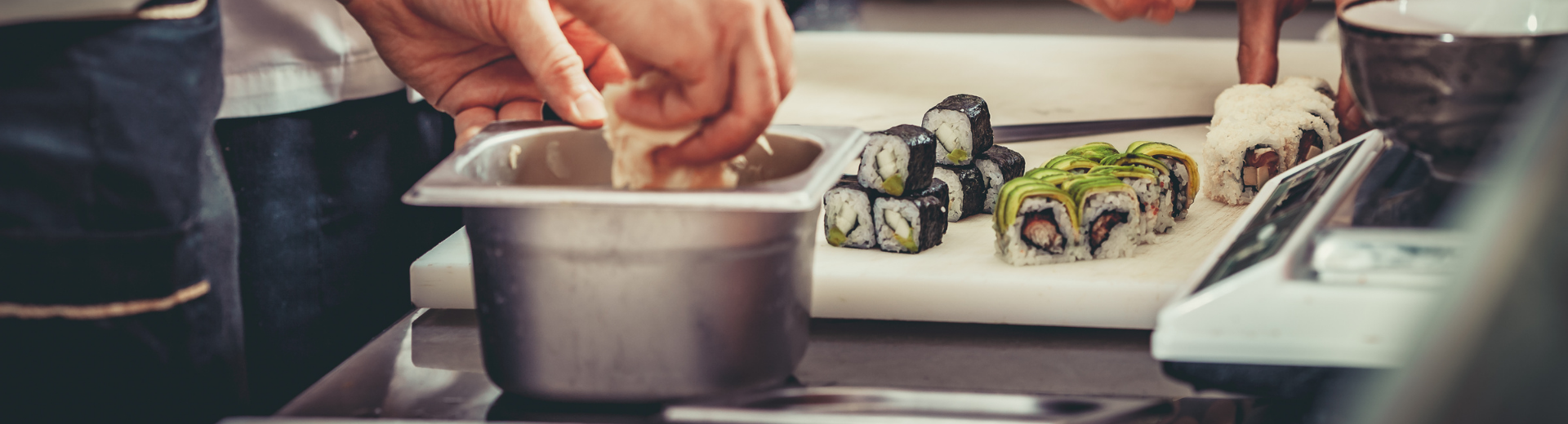 Preparing sushi in restaurant kitchen