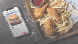 To-Go Delivery chicken and fries with mobile device