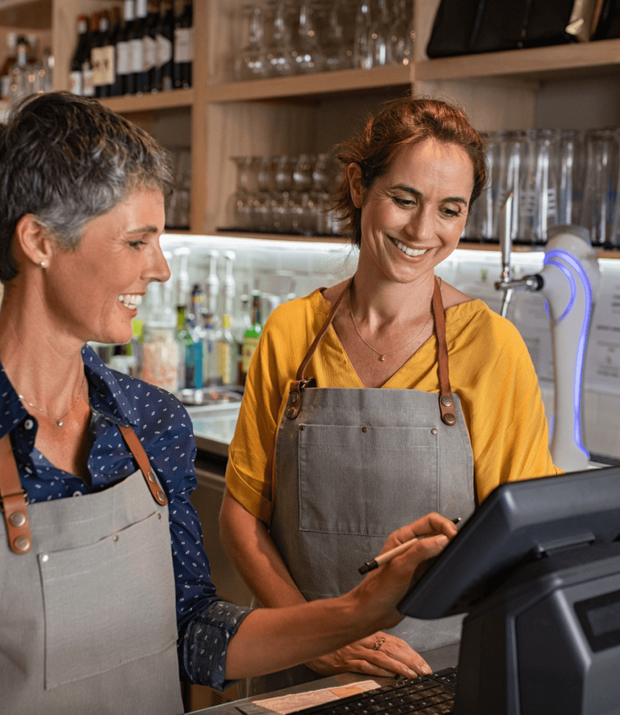 2 women at POS in bar of restaurant