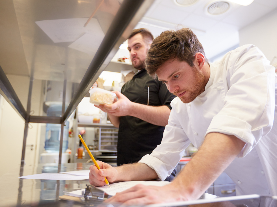 Chefs performing inventory in a restaurant