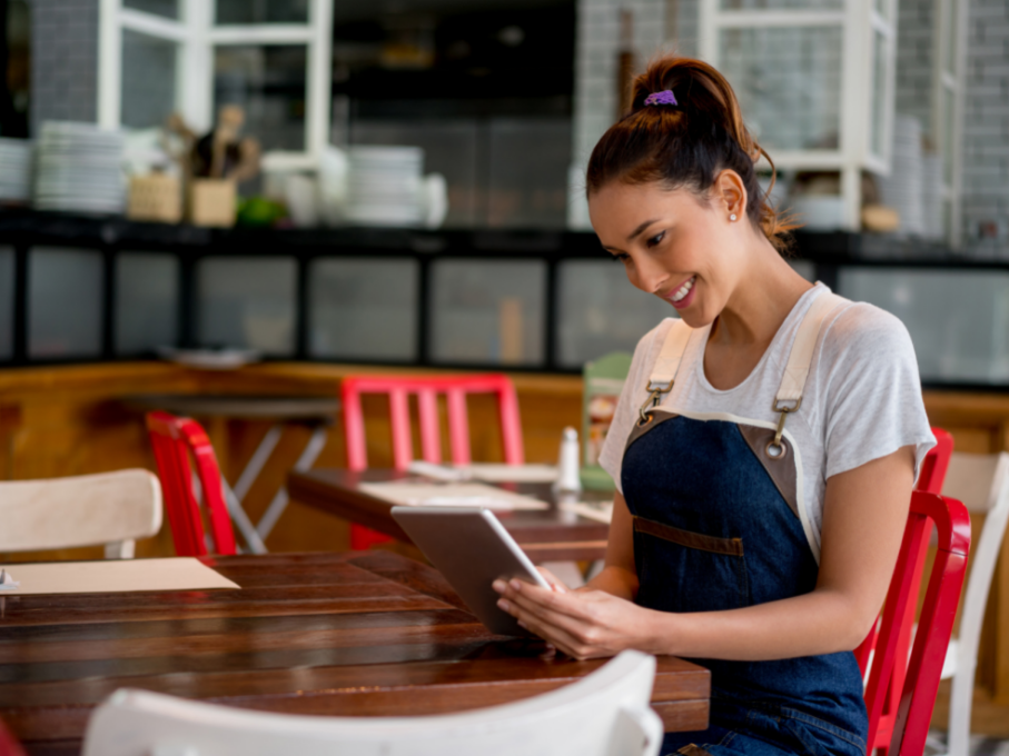 Operator looking at tablet in restaurant