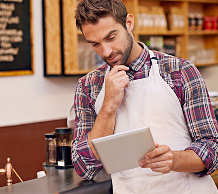 Restaurant employee working on a tablet