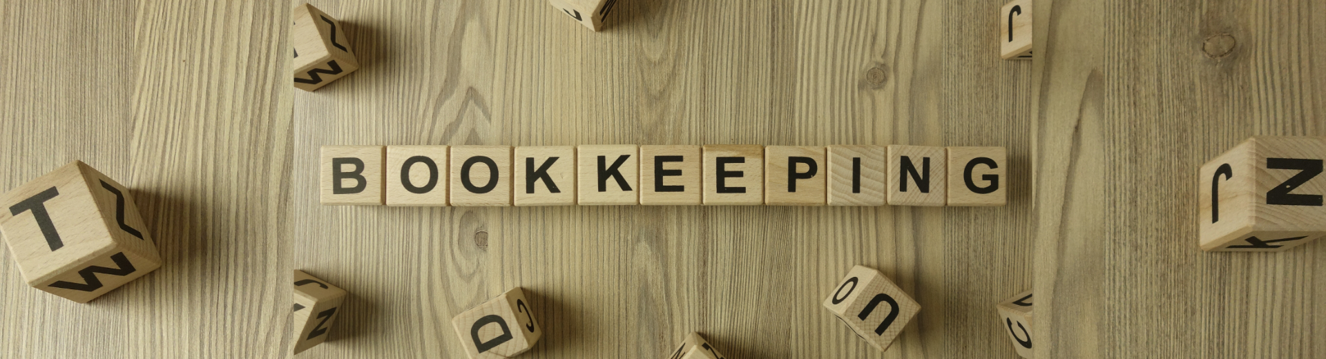 Bookkeeping spelled out with wooden blocks