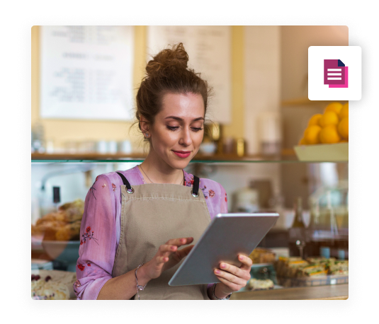 Reporting restaurant employee looking at restaurant reports on tablet